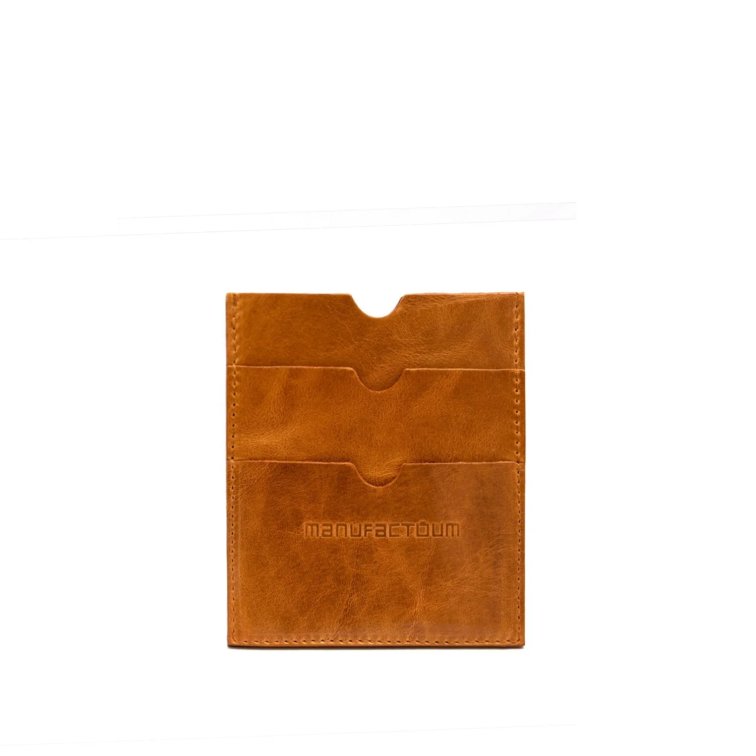 Porte-cartes en cuir marron avec deux compartiments. Le mot MANUFACTUM est gravé sur le devant.