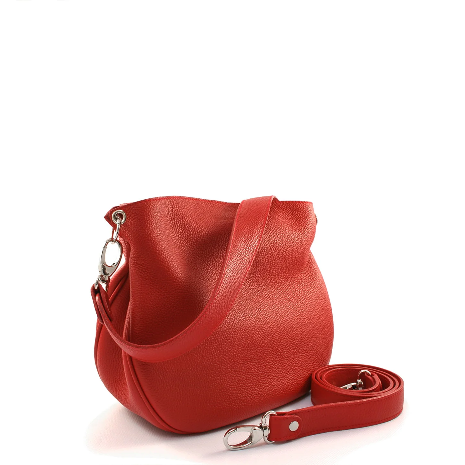 Un sac à main en cuir rouge avec une bandoulière amovible placée à côté.