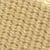 Gros plan d'un tissu tissé marron texturé avec un motif répétitif de formes arrondies.